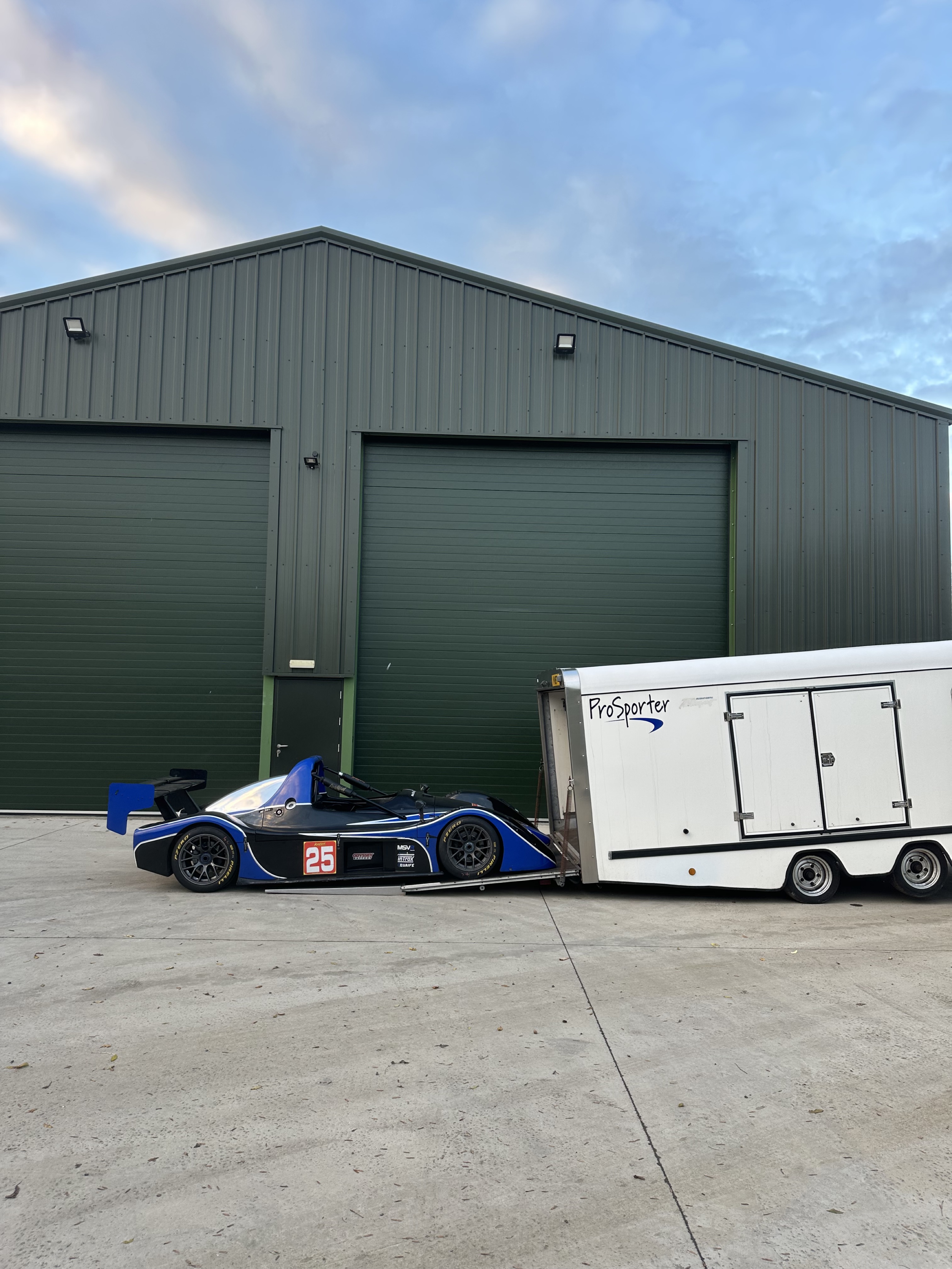 Defender and Prosporter in front of facility