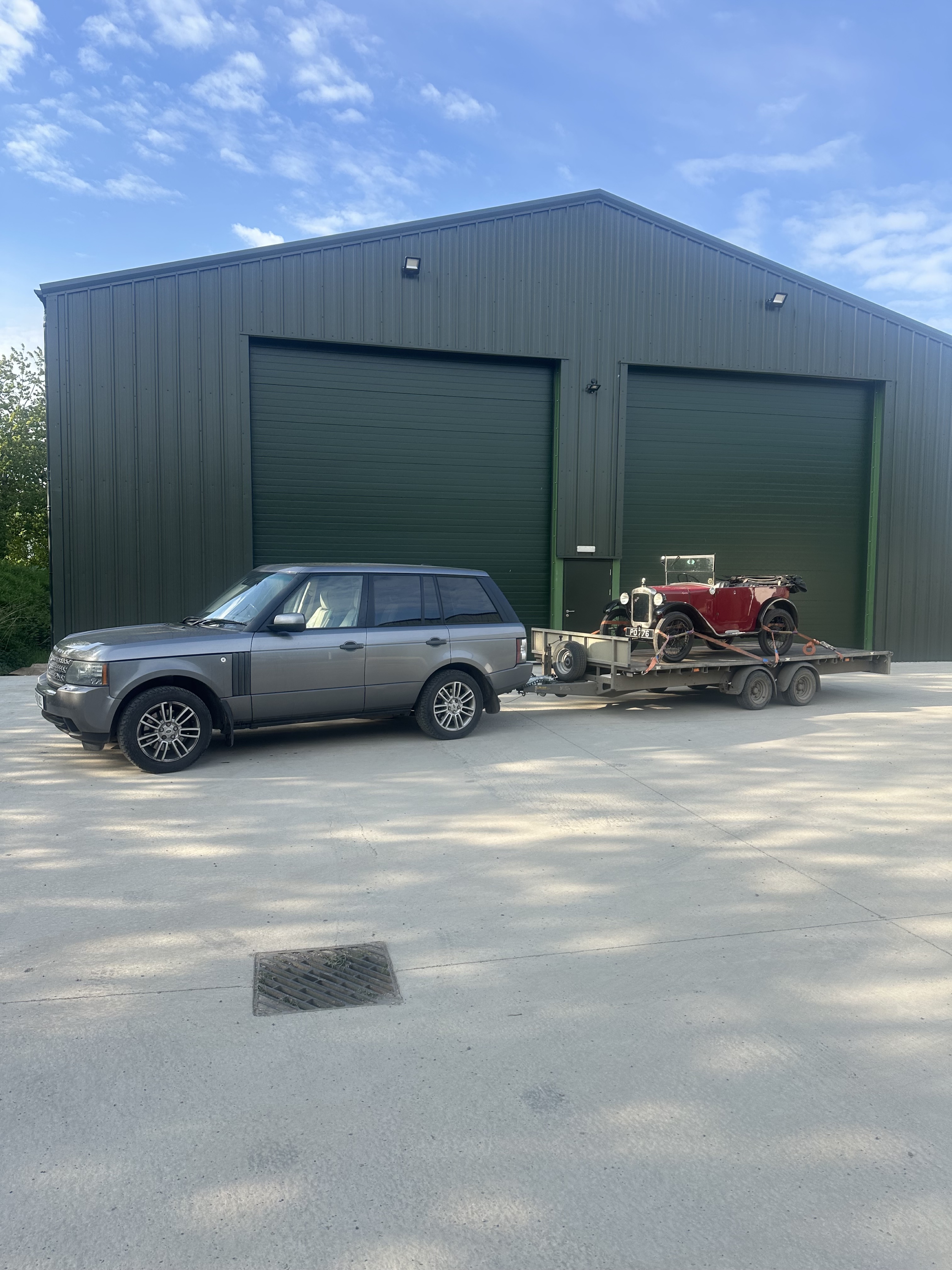 Race car loading into covered trailer